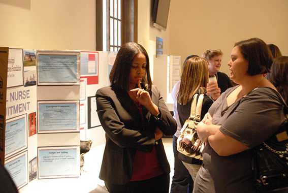 Nursing students Katrina Cotton (left) of Greenwood, and Samantha Justice of Golden, discuss their research during Delta State’s Robert E. Smith School of Nursing annual research day.